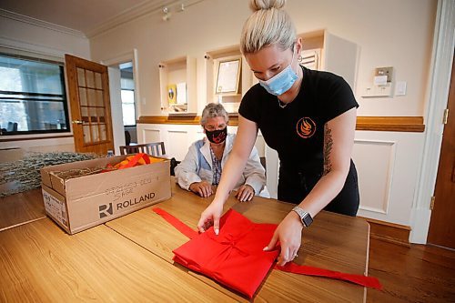 JOHN WOODS / WINNIPEG FREE PRESS
Trinity Tomm, right, assists Sylvia Genaille, councillor and elder, prepare a package of documents for Kamloops at the National Centre for Truth and Reconciliation in Winnipeg Wednesday, September 22, 2021. 

Reporter: Martin