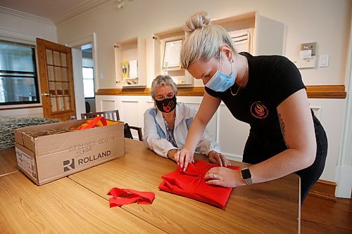 JOHN WOODS / WINNIPEG FREE PRESS
Trinity Tomm, right, assists Sylvia Genaille, councillor and elder, prepare a package of documents for Kamloops at the National Centre for Truth and Reconciliation in Winnipeg Wednesday, September 22, 2021. 

Reporter: Martin