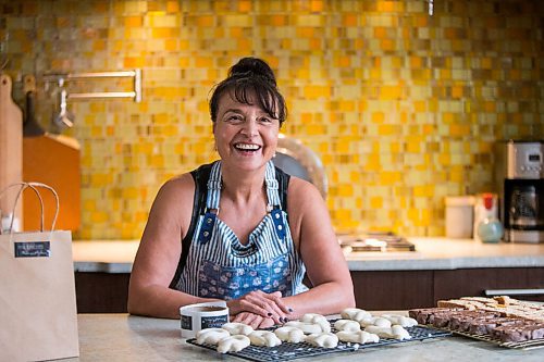 MIKAELA MACKENZIE / WINNIPEG FREE PRESS

Sylvia Aiello, owner of Ms. Biscotti, poses for a portrait with her biscotti in her home kitchen in Winnipeg on Wednesday, Sept. 22, 2021.  For Dave Sanderson story.
Winnipeg Free Press 2021.
