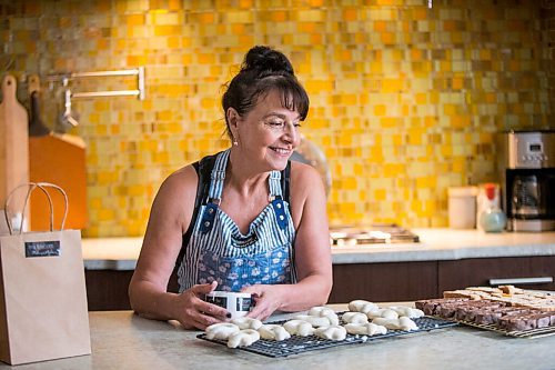 MIKAELA MACKENZIE / WINNIPEG FREE PRESS

Sylvia Aiello, owner of Ms. Biscotti, poses for a portrait with her biscotti in her home kitchen in Winnipeg on Wednesday, Sept. 22, 2021.  For Dave Sanderson story.
Winnipeg Free Press 2021.