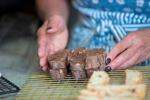 MIKAELA MACKENZIE / WINNIPEG FREE PRESS

Sylvia Aiello packages up chocolate chunk and roasted chestnut biscotti in her home kitchen in Winnipeg on Wednesday, Sept. 22, 2021.  For Dave Sanderson story.
Winnipeg Free Press 2021.