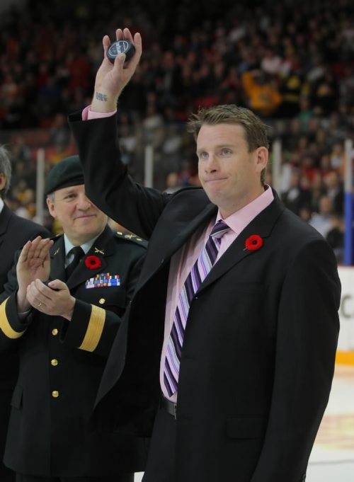 Brandon Sun CORRECTION( DINGMAN)--Former Brandon Wheat King and Memorial Cup winner Chris Digman waves to the crowd at Westman Place prior to the ceremonial puck -drop during the opening game at the MasterCard Memorial Cup in Brandon, Man., on May 14, 2010. (Bruce Bumstead/Brandon Sun)