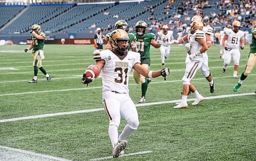 MIKE SUDOMA / Winnipeg Free Press
Bisons running back, Victor St. Pierre-Laviolette makes his past Regina Rams defence to score a 2pt conversion during the Bisons home opener Saturday
September 25, 2021