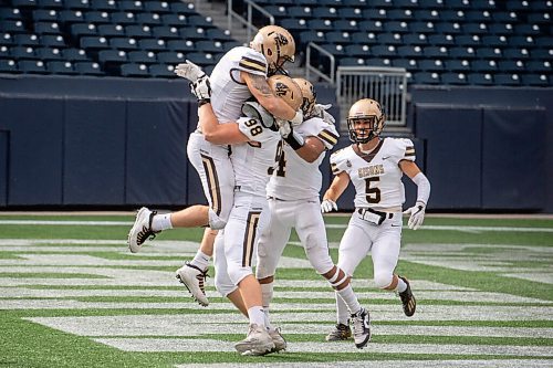 MIKE SUDOMA / WINNIPEG FREE PRESS
The team shares a moment with Defence, Brock Gowanlock (left) after he ran in a second half touch down Saturday
September 25, 2021