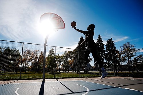 JOHN WOODS / WINNIPEG FREE PRESS
Hafiz shoots hoops on a beautiful day at St Johns Park in Winnipeg Sunday, September 26, 2021. 

Reporter: Standup