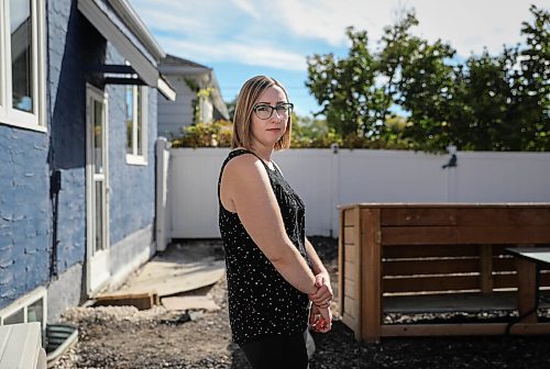 JESSICA LEE / WINNIPEG FREE PRESS

Kaitlin Bialek stands in her backyard on September 27, 2021. In late May, due to a city contractor error, cement flooded the pipes of her home and several surrounding homes on Semple Avenue. Her pipes were recently replaced but her basement and backyard are now in an unfinished state.

Reporter: Joyanne