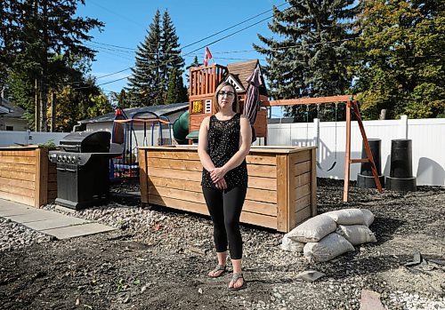 JESSICA LEE / WINNIPEG FREE PRESS

Kaitlin Bialek stands in her backyard on September 27, 2021. In late May, due to a city contractor error, cement flooded the pipes of her home and several surrounding homes on Semple Avenue. Her pipes were recently replaced but her basement and backyard are now in an unfinished state.

Reporter: Joyanne