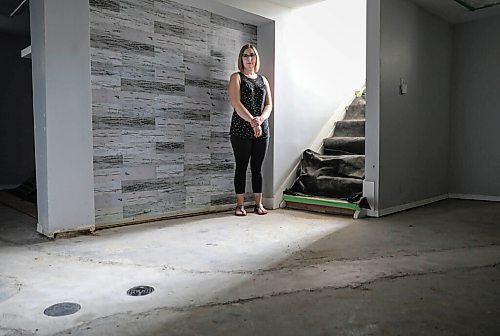 JESSICA LEE / WINNIPEG FREE PRESS

Kaitlin Bialek stands in her basement on September 27, 2021. In late May, due to a city contractor error, cement flooded the pipes of her home and several surrounding homes on Semple Avenue. Her pipes were recently replaced but her basement, which was previously finished, is now in an unfinished state.

Reporter: Joyanne