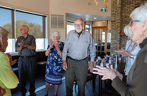 JESSICA LEE / WINNIPEG FREE PRESS

Henry Esau, centre, makes a speech on September 22, 2021 at Larters at St. Andrews Golf and Country Club while his friends clap.

In 1956, 14 couples from Winnipeg married and formed a club they called Club 56. They have been meeting every year since 1956, however this meeting is their last meeting because the members are aging and some have moved out of the province. The original group of 28 is now a group of 14 as some members have passed away or moved out of province.

Reporter: Ben