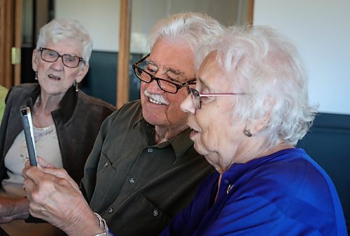 JESSICA LEE / WINNIPEG FREE PRESS

Vanita Schmidt, holds her phone as Jake and Irene, another couple part of Club 56 video calls from Edmonton on September 22, 2021 during the last Club 56 meet-up. Her husband Victor and friend Esther Braun are also pictured in the photo.

In 1956, 14 couples from Winnipeg married and formed a club they called Club 56. They have been meeting every year since 1956, however this meeting is their last meeting because the members are aging and some have moved out of the province. The original group of 28 is now a group of 14 as some members have passed away or moved out of province.

Reporter: Ben