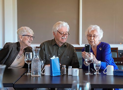 JESSICA LEE / WINNIPEG FREE PRESS

Vanita Schmidt, holds her phone as Jake and Irene, another couple part of Club 56 video calls from Edmonton on September 22, 2021 during the last Club 56 meet-up. Her husband Victor and friend Esther Braun are also pictured in the photo.

In 1956, 14 couples from Winnipeg married and formed a club they called Club 56. They have been meeting every year since 1956, however this meeting is their last meeting because the members are aging and some have moved out of the province. The original group of 28 is now a group of 14 as some members have passed away or moved out of province.

Reporter: Ben