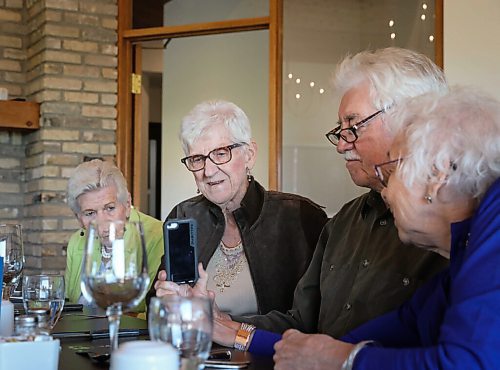 JESSICA LEE / WINNIPEG FREE PRESS

Vanita Schmidt, holds her phone as Jake and Irene, another couple part of Club 56 video calls from Edmonton on September 22, 2021 during the last Club 56 meet-up. Her husband Victor and friends Esther Braun and Verna Froese, far left, are also pictured in the photo.

In 1956, 14 couples from Winnipeg married and formed a club they called Club 56. They have been meeting every year since 1956, however this meeting is their last meeting because the members are aging and some have moved out of the province. The original group of 28 is now a group of 14 as some members have passed away or moved out of province.

Reporter: Ben