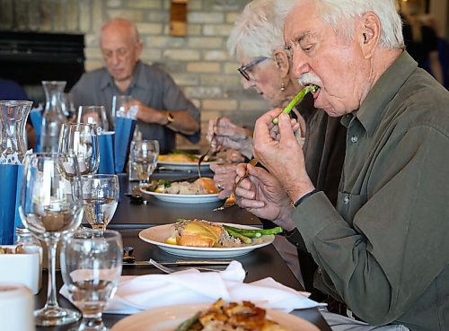 JESSICA LEE / WINNIPEG FREE PRESS

Victor Schmidt, right, digs into his lunch on September 22, 2021 at Larters at St. Andrews Golf and Country Club during the last Club 56 meet-up.

In 1956, 14 couples from Winnipeg married and formed a club they called Club 56. They have been meeting every year since 1956, however this meeting is their last meeting because the members are aging and some have moved out of the province. The original group of 28 is now a group of 14 as some members have passed away or moved out of province.

Reporter: Ben
