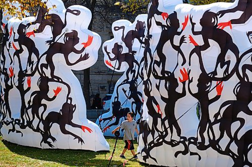 MIKE DEAL / WINNIPEG FREE PRESS
Dedrik Kematch, 7, walks through the See Hear Speak art installation by Paul Robles in the Old Market Square in Winnipeg's Exchange District, Tuesday afternoon.
210928 - Tuesday, September 28, 2021.