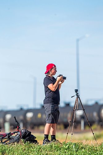 MIKAELA MACKENZIE / WINNIPEG FREE PRESS

Evan McRae, 13, shoots photos and records video of trains east of Symington Yards in Winnipeg on Monday, Sept. 27, 2021.  For the last two years, the young rail fan has been going out to watch trains around the city. For --- story.
Winnipeg Free Press 2021.