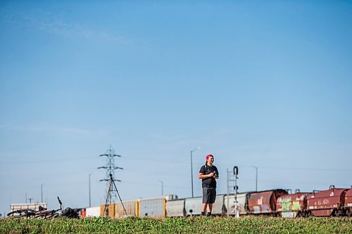 MIKAELA MACKENZIE / WINNIPEG FREE PRESS

Evan McRae, 13, shoots photos and records video of trains east of Symington Yards in Winnipeg on Monday, Sept. 27, 2021.  For the last two years, the young rail fan has been going out to watch trains around the city. For --- story.
Winnipeg Free Press 2021.