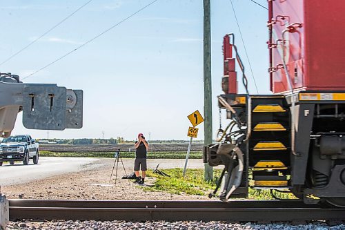 MIKAELA MACKENZIE / WINNIPEG FREE PRESS

Evan McRae, 13, shoots photos and records video of trains east of Symington Yards in Winnipeg on Monday, Sept. 27, 2021.  For the last two years, the young rail fan has been going out to watch trains around the city. For --- story.
Winnipeg Free Press 2021.