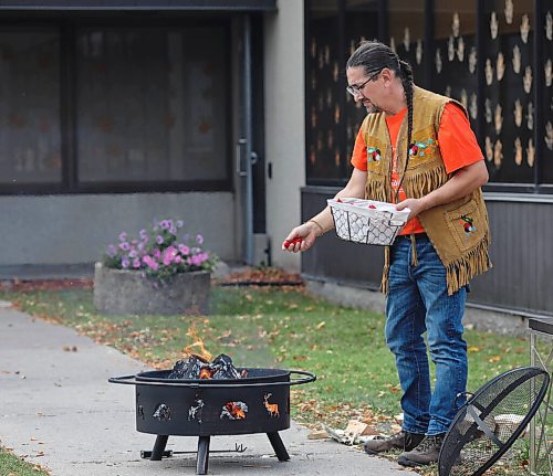 JESSICA LEE / WINNIPEG FREE PRESS

Fire keeper Richard Shrupka throws tobacco into a sacred fire at Ma Mawi Wi Chi Itata Centre on September 30, 2021 for Truth and Reconciliation Day. The tobacco was gathered by youth and the bundles represent anguish, pain, hopes and dreams. The bundles are thrown into the fire in hopes that the creator will listen.



