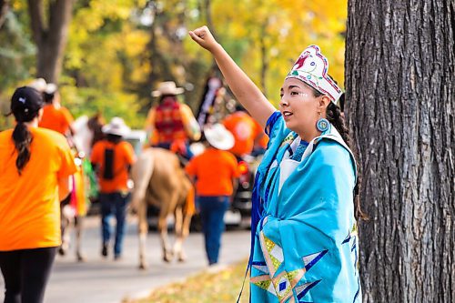 MIKAELA MACKENZIE / WINNIPEG FREE PRESS

Fancy shawl dancer Cierra Roulette raises a fist in solidarity with a march that went from the Canadian Museum for Human Rights to St. John's Park on the first National Day for Truth and Reconciliation in Winnipeg on Thursday, Sept. 30, 2021. For --- story.
Winnipeg Free Press 2021.