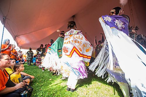 MIKAELA MACKENZIE / WINNIPEG FREE PRESS

Riley Brown (Every Child Matters shawl) dances in the grand entry at a Pow Wow at St. John's Park on the first National Day for Truth and Reconciliation in Winnipeg on Thursday, Sept. 30, 2021. For --- story.
Winnipeg Free Press 2021.