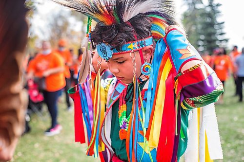 MIKAELA MACKENZIE / WINNIPEG FREE PRESS

Daerion Hidalgo (nine) adjusts his regalia at a Pow Wow at St. John's Park on the first National Day for Truth and Reconciliation in Winnipeg on Thursday, Sept. 30, 2021. For --- story.
Winnipeg Free Press 2021.