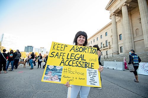 MIKE SUDOMA / Winnipeg Free Press
Paige Mason holds up a sign as she takes part in the Rally for Reproductive Justice Saturday afternoon
October 2, 2021