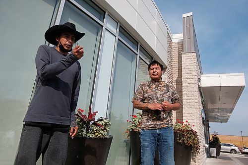 JOHN WOODS / WINNIPEG FREE PRESS
Corey Keeper, left, and his uncle Sheldon, from Pauingasi, talk to media about returning home in Winnipeg Sunday, October 3, 2021. Families evacuated from Little Grand Rapids and Pauingassi because of fire have been told they can return home.

Reporter: Piche