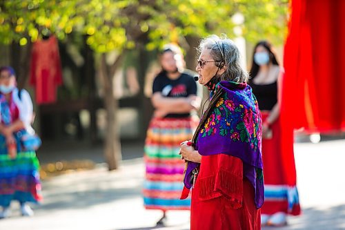 MIKAELA MACKENZIE / WINNIPEG FREE PRESS

Elder Carolyn Moar speaks at a sacred fire at City Hall in honour of a day of action and awareness for missing and murdered Indigenous women, girls, and two-spirited peoples in Winnipeg on Monday, Oct. 4, 2021. For --- story.
Winnipeg Free Press 2021.