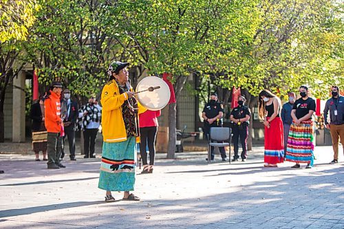 MIKAELA MACKENZIE / WINNIPEG FREE PRESS

Bev Jones sings an eagle song at a sacred fire at City Hall in honour of a day of action and awareness for missing and murdered Indigenous women, girls, and two-spirited peoples in Winnipeg on Monday, Oct. 4, 2021. For --- story.
Winnipeg Free Press 2021.