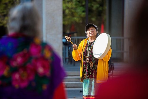 MIKAELA MACKENZIE / WINNIPEG FREE PRESS

Bev Jones sings a bear song at a sacred fire at City Hall in honour of a day of action and awareness for missing and murdered Indigenous women, girls, and two-spirited peoples in Winnipeg on Monday, Oct. 4, 2021. For --- story.
Winnipeg Free Press 2021.