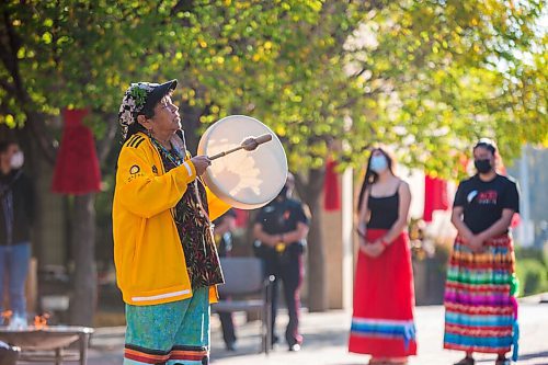 MIKAELA MACKENZIE / WINNIPEG FREE PRESS

Bev Jones sings an eagle song at a sacred fire at City Hall in honour of a day of action and awareness for missing and murdered Indigenous women, girls, and two-spirited peoples in Winnipeg on Monday, Oct. 4, 2021. For --- story.
Winnipeg Free Press 2021.