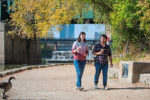 MIKAELA MACKENZIE / WINNIPEG FREE PRESS

Alexa McAdam and Brendan Klassen enjoy a walk and some ice cream at The Forks in Winnipeg on Monday, Oct. 4, 2021. Winnipeg has been setting weather records with the gloriously warm fall weather. For JS story.
Winnipeg Free Press 2021.