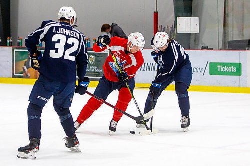 MIKE DEAL / WINNIPEG FREE PRESS
Manitoba Moose' Trent Bourque (38) tries battles for the puck against Thomas Caron (50) during practice at MTS Iceplex Monday morning.
211004 - Monday, October 04, 2021.