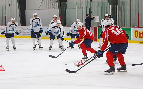 MIKE DEAL / WINNIPEG FREE PRESS
Manitoba Moose' Hayden Shaw (28) passes the puck to Jimmy Oligny (14) during practice at MTS Iceplex Monday morning.
211004 - Monday, October 04, 2021.