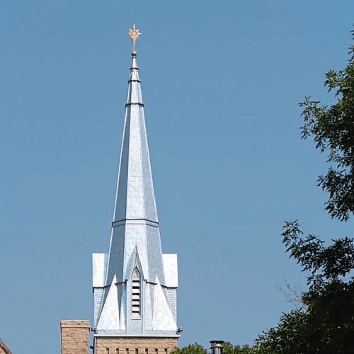 Canstar Community News Photo by Trevor Smith 
The spire at Augustine Centre (formerly Augustine United Church) has been freshly painted and its cross newly gilded with gold leaf.
