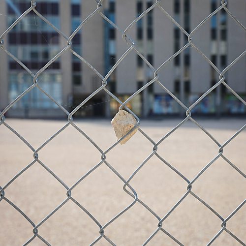 JESSICA LEE / WINNIPEG FREE PRESS

A rock is stuck in the fence of an empty plot of concrete, once the site of the St. Regis Hotel on October 4, 2021. Sunshine Wood was last seen there in 2004.

Reporter: Melissa


