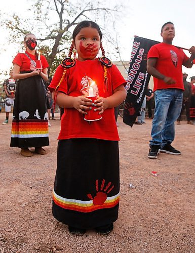 JOHN WOODS / WINNIPEG FREE PRESS
Anastasia, 5, sister of Eishia Hudson who was shot by police, holds a candle as people gather for a vigil and place candles around the Murdered and Missing Women and Girls (MMIWG) monument at the Forks during MMIWG day in Winnipeg Monday, October 4, 2021. 

Reporter: May