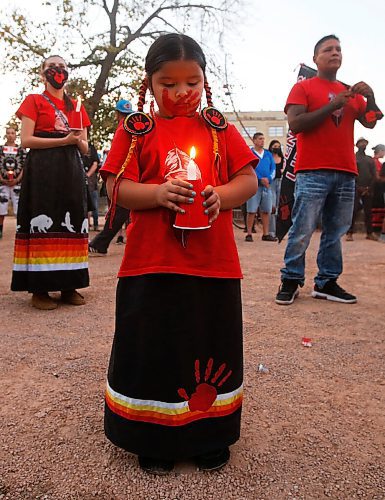 JOHN WOODS / WINNIPEG FREE PRESS
Anastasia, 5, sister of Eishia Hudson who was shot by police, holds a candle as people gather for a vigil and place candles around the Murdered and Missing Women and Girls (MMIWG) monument at the Forks during MMIWG day in Winnipeg Monday, October 4, 2021. 

Reporter: May