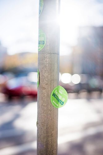 MIKAELA MACKENZIE / WINNIPEG FREE PRESS

COVID-19 vaccination stickers decorate a parking signpost outside of the the RBC Convention Centre vaccination supersite in Winnipeg on Tuesday, Oct. 5, 2021. For Gabby story.
Winnipeg Free Press 2021.