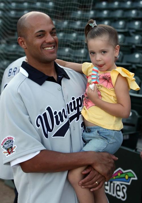 BORIS.MINKEVICH@FREEPRESS.MB.CA  100519 BORIS MINKEVICH / WINNIPEG FREE PRESS Kevin West with one of his biggest fans his daughter Payton,4, at the ball park.