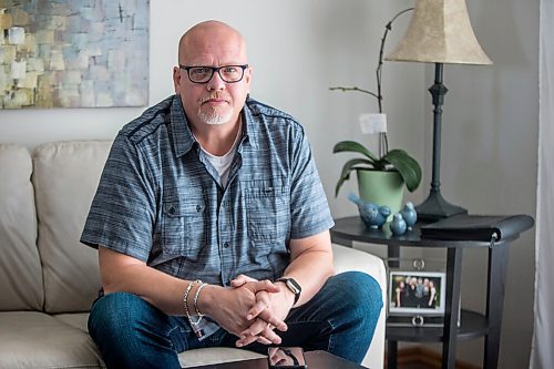 MIKAELA MACKENZIE / WINNIPEG FREE PRESS

Jason Lerato, former anti-vaxxer who has now changed his mind and gotten vaccinated, poses for a portrait in his home in Winnipeg on Tuesday, Oct. 5, 2021. For Malak story.
Winnipeg Free Press 2021.