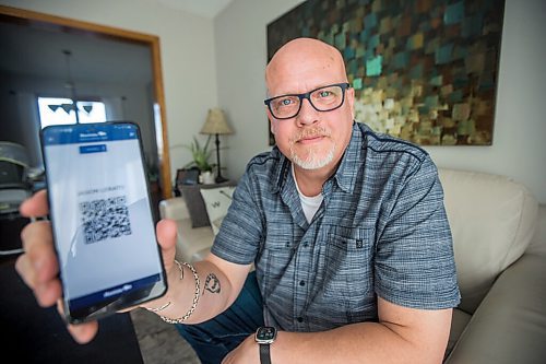 MIKAELA MACKENZIE / WINNIPEG FREE PRESS

Jason Lerato, former anti-vaxxer who has now changed his mind and gotten vaccinated, poses for a portrait in his home in Winnipeg on Tuesday, Oct. 5, 2021. For Malak story.
Winnipeg Free Press 2021.