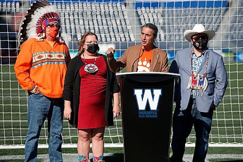 JOHN WOODS / WINNIPEG FREE PRESS
MKO vice chief David Monias, from left, Regional Chief Cindy Woodhouse and SCO Grand Chief Jerry Daniels  listen in as AMC grand chief Arlen Dumas speaks at a Blue Bomber jersey launch at the Blue Bomber stadium in Winnipeg Tuesday, October 5, 2021. Wade Miller and the Winnipeg Blue Bombers unveiled a special orange  jersey that will be worn by both the Blue Bombers and Elks for pre-game warmup this Friday, to recognize Orange Shirt Day. 

Reporter: Allen