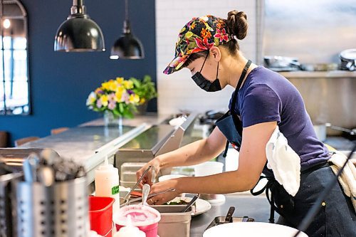 MIKAELA MACKENZIE / WINNIPEG FREE PRESS

Chef Emily Butcher prepares dishes at Nola, a new restaurant in St. Boniface, on Friday, Oct. 8, 2021. For Eva Wasney story.
Winnipeg Free Press 2021.