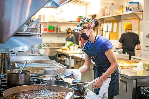 MIKAELA MACKENZIE / WINNIPEG FREE PRESS

Chef Emily Butcher prepares dishes at Nola, a new restaurant in St. Boniface, on Friday, Oct. 8, 2021. For Eva Wasney story.
Winnipeg Free Press 2021.