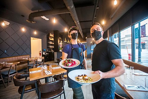 MIKAELA MACKENZIE / WINNIPEG FREE PRESS

Chef Emily Butcher and Mike Del Buono pose for a portrait with signature dishes at Nola, their new restaurant, in St. Boniface on Friday, Oct. 8, 2021. For Eva Wasney story.
Winnipeg Free Press 2021.