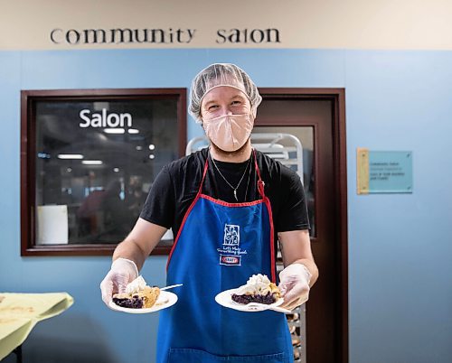 JESSICA LEE / WINNIPEG FREE PRESS

Dallas Holden, a staff member, holds up plates of pie at Siloam Mission on October 8, 2021. The organization fed dozens of community members Thanksgiving lunch earlier that day.

Reporter: Erik