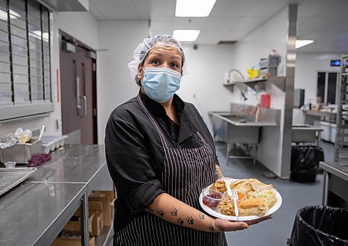 JESSICA LEE / WINNIPEG FREE PRESS

Sonja Lavallee, a staff member, holds up a plate of Thanksgiving lunch in Siloam Missions kitchen on October 8, 2021. The organization fed dozens of community members earlier.

Reporter: Erik