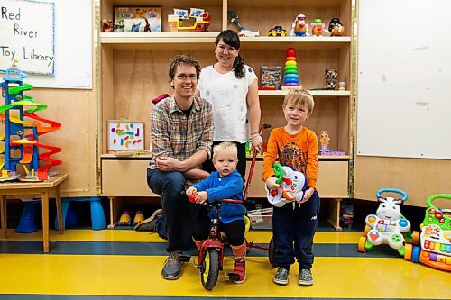 Daniel Crump / Winnipeg Free Press. Ian Scott (left) and Landon Gibson (middle back) with their kids Freddie Gibson Scott (5) (right) and Moe Gibson Scott (2) (middle front). Landon and Ian started thered River Toy Library as a way for parents to share and reuse toys rather than constantly having buy new ones. October 9, 2021.