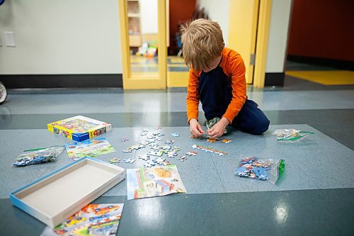 Daniel Crump / Winnipeg Free Press. Freddie Gibson Scott (5) works on a puzzle. Landon and Ian started thered River Toy Library as a way for parents to share and reuse toys rather than constantly having buy new ones. October 9, 2021.